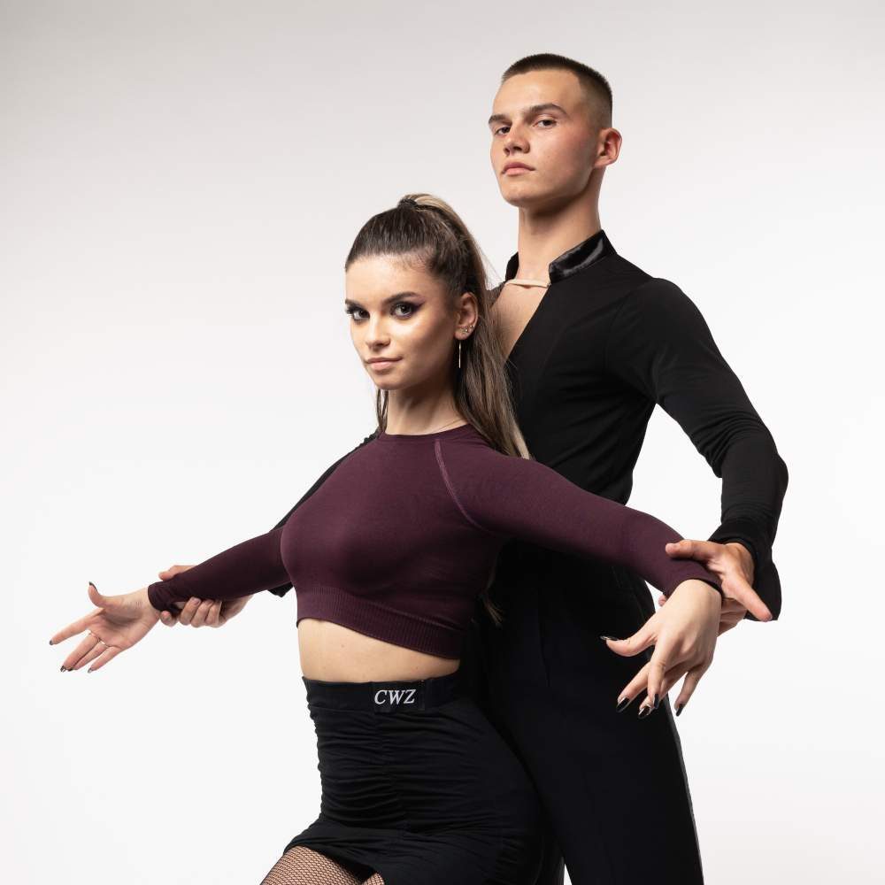 Dance couple, the female partner in front with her arms open